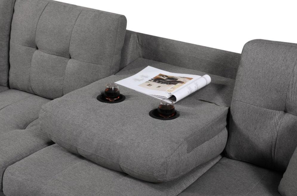 Canapé gauche en tissu avec pouf
